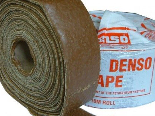 Roll of Denso tape with packaging on a white background