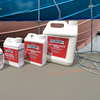NORSKI boat cleaning products on a dock with a blue boat in the background