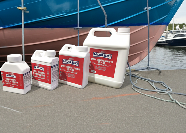 NORSKI boat cleaning products on a dock with a blue boat in the background