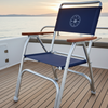 Chair with a blue backrest on a boat deck during sunset.