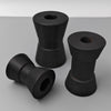 Three black trailer bushings on a gray background