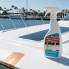 Bottle of Rust Stain Remover on a boat with a marina background