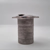 Textured cylindrical object on a gray background
