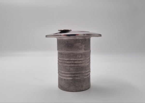 Textured cylindrical object on a gray background