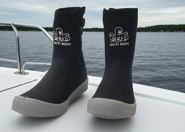 Black Octi Boot socks on a boat with water and sky in the background