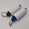 Two white and blue cylindrical keychain items with metal rings on a light gray background