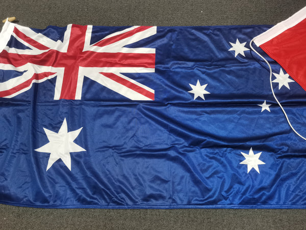 Waving Australian flag on a gray surface