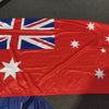 Australian flag with Union Jack design on a dark surface