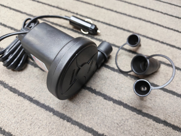 air pump with a cable on a textured carpet