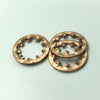 Two bronze washers on a light blue background
