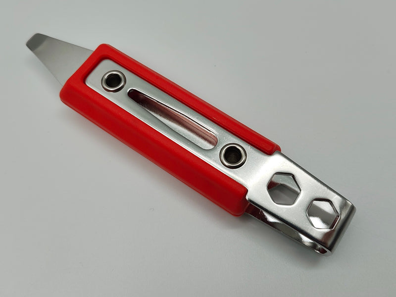 Red and silver utility knife on a light gray background