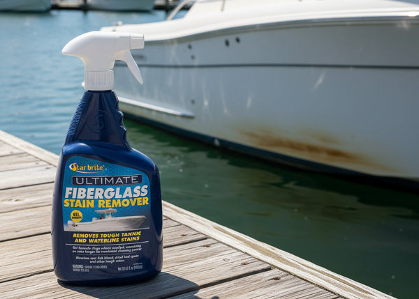 A bottle of Star Brite Ultimate Fiberglass Stain Remover spray, featuring a dark blue bottle and white trigger sprayer against a light gray background.