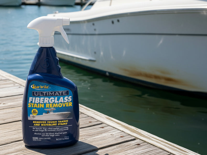 A bottle of Star Brite Ultimate Fiberglass Stain Remover spray, featuring a dark blue bottle and white trigger sprayer against a light gray background.
