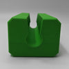 A bright green 3D-printed U-shaped block with concentric circular layer lines, shown on a neutral gray background.