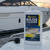 Star brite Bilge Cleaner bottle on a boat with a yacht in the background