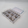 Angled photo of screws in a lightbox inside a box with seperate compartments 
18 different size screws