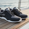 Black and gray sneakers on a boat deck with ocean view