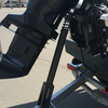 Outboard motor on a trailer with a marina background