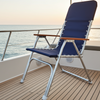 Blue lounge chair on a boat deck with ocean view