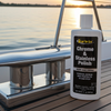 Starbrite Chrome & Stainless Polish bottle on a boat deck with sunset in the background