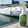 Bird & Spider stain remover bottle on a dock with a sailboat in the background