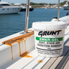Grunt Emer-Gel rust, stain, and oxidation remover container on a boat deck with water and yachts in the background.
