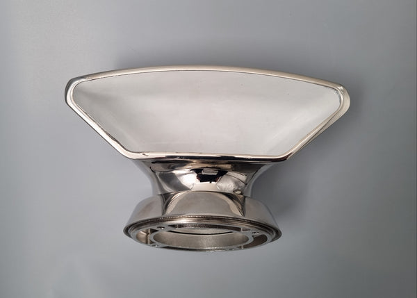 Metallic vent scoop fixture on a gray background